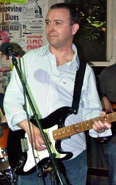 Me playing my black Strat